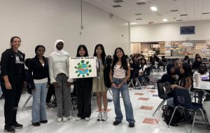 The Beginning: Students for Humanity officers, senior Jenney Luong, senior Michella Dao, sophomore Mariam Alimi, sophomore Katelyn Nguyen, Junior Aresema Hagos, and sponsor Karen Orta gather with new members in the cafeteria. The officers outline the club’s mission and planned volunteer events for the upcoming year, encouraging students to join their community efforts. “We can’t wait to see what this year has in store,” said Officer Nguyen.