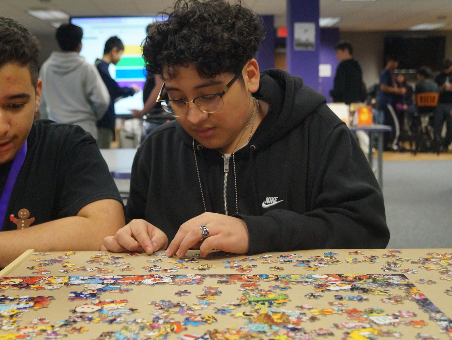 Santiago Martinez builds a Disney Puzzle during his lunch period in the library.