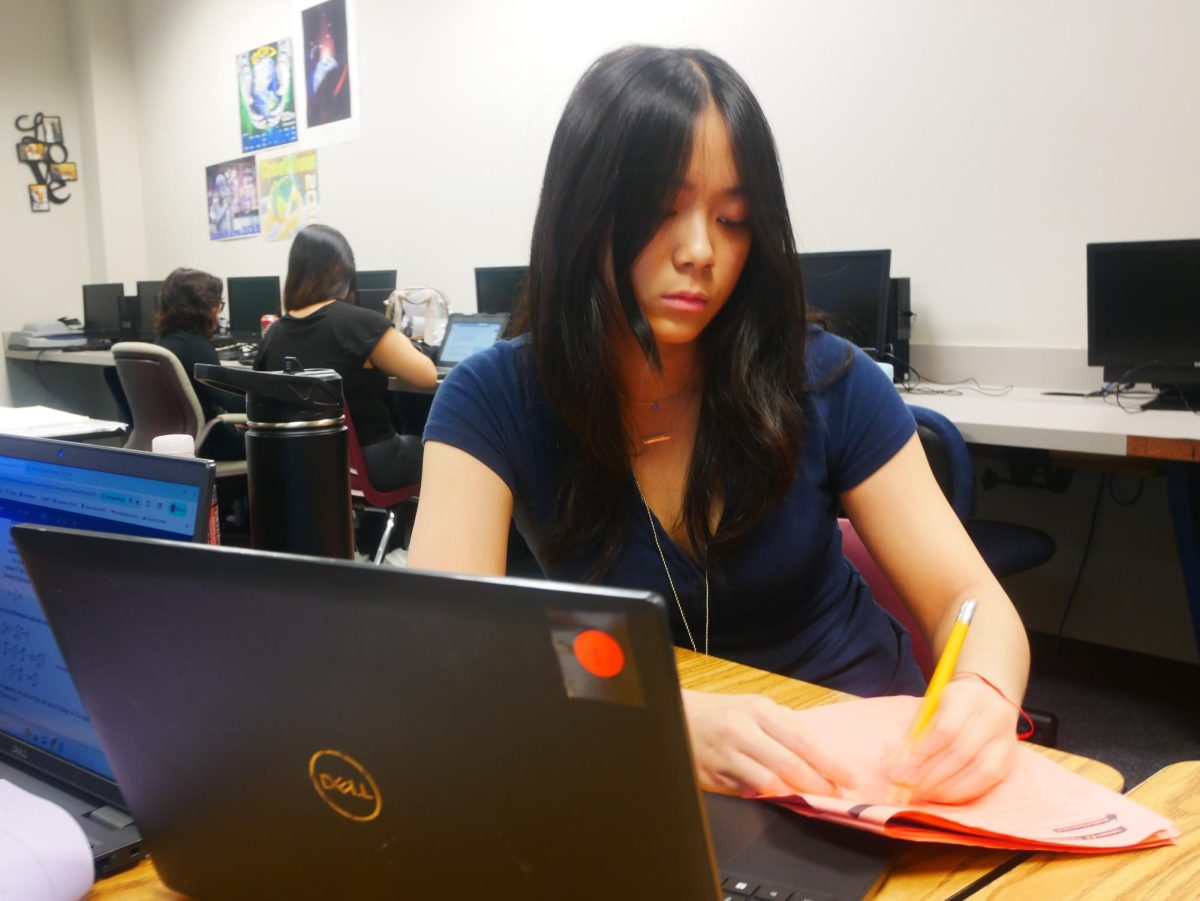 Angelina Ho (11) does her school work on her 
schoool issused device