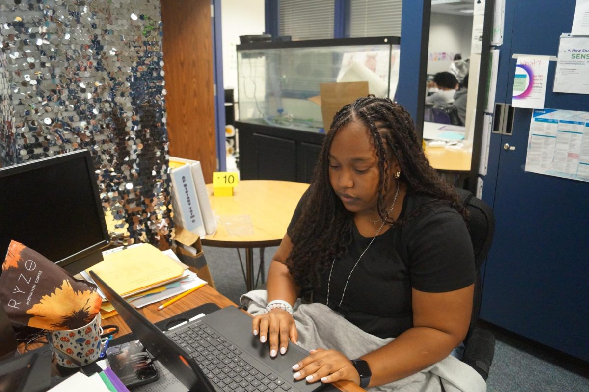 Antiona Rufua (12) works on her math assignments on her laptop.