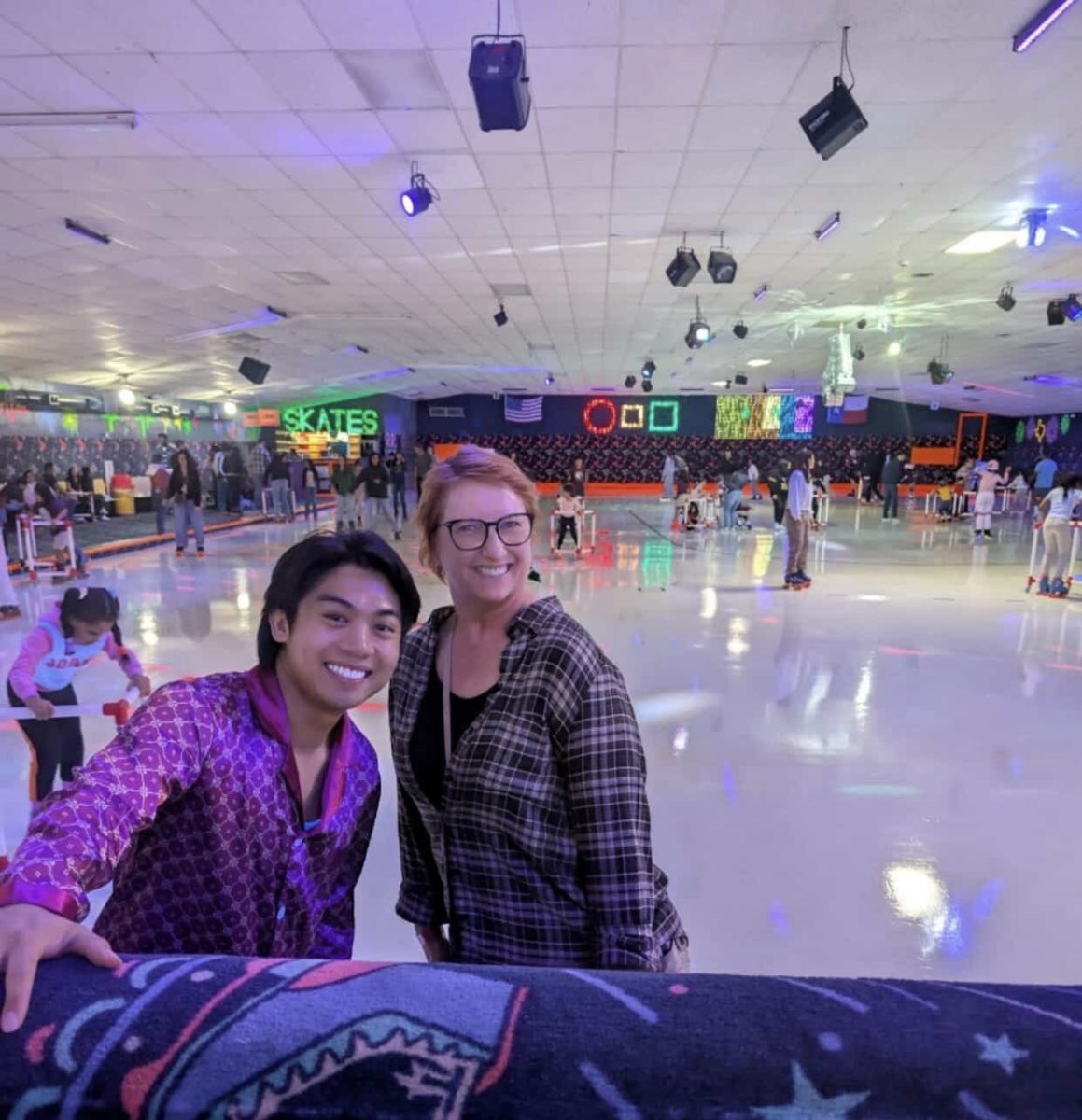 Rolling into Pajama Night: Choirs sponsor Allen Silagan and Margaret Bancroft pose together while roller skating at Dairy Ashford Roller Rink as students skate around them. The event was a choir social that brought students and staff together for an after-school hours event. “It was fun seeing everyone dressed in pajamas and just having a good time,” Parker Hansbrough said.