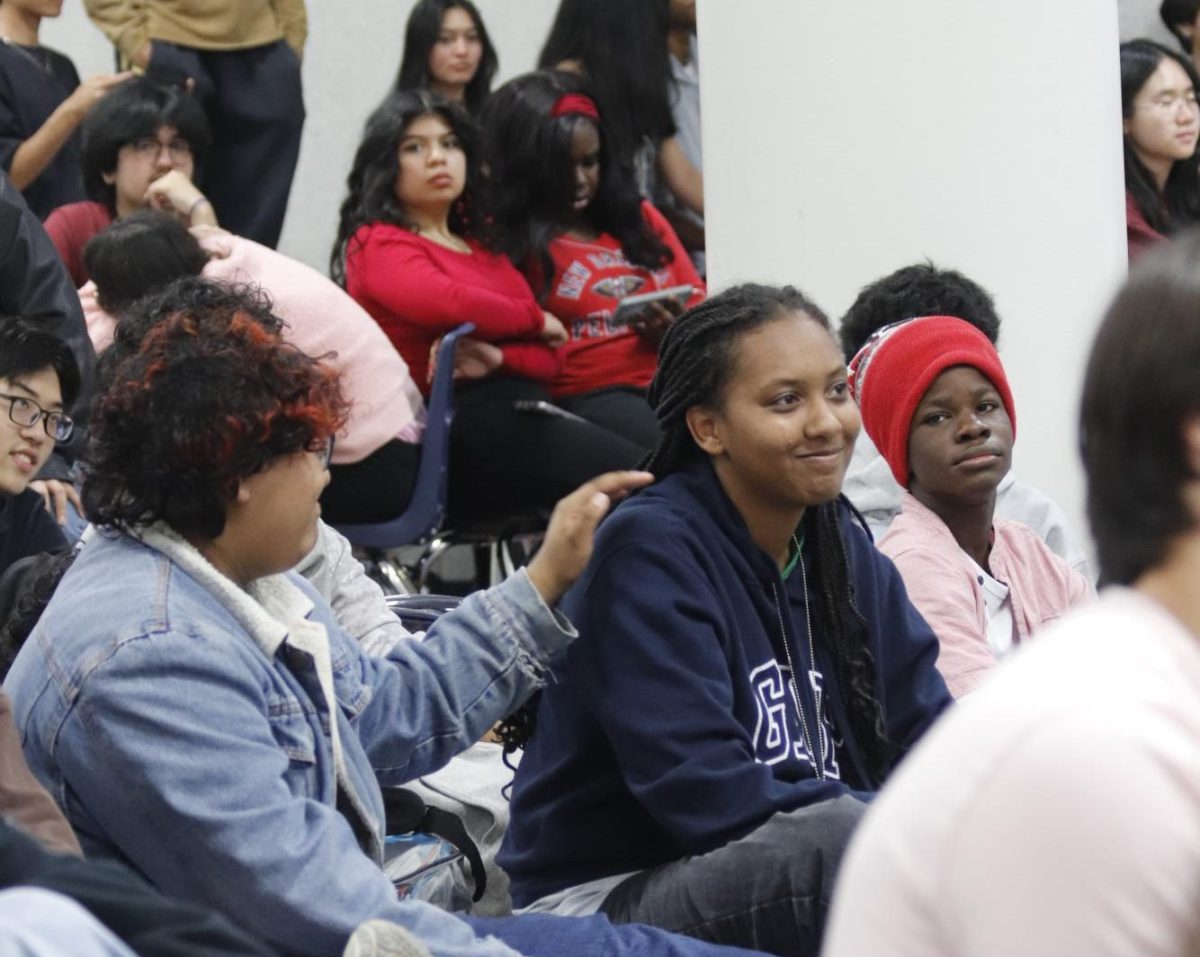 Bidding for More: Michelle Takie (10) and Eliana Perez (10) are attempting to bid for a letter. With the minimum bid set at 10 dollars, she was unable to meet the required increase in the letters. “I wanted to bid, but I only had 10 dollars on me at the time,” Takie said.
