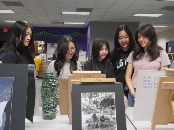 Great Gallopers: Kalley Lam (11), Thao Chu (11), Tran Nguyen (11), Claire Han (12), and Mary Nguyen (11) admire the creations surrounding them. Nguyen was drawn to the illustrations depicting her favorite animal, horses. “I love their wild yet elegant nature, and I felt that the art captured their essence,” Nguyen said.