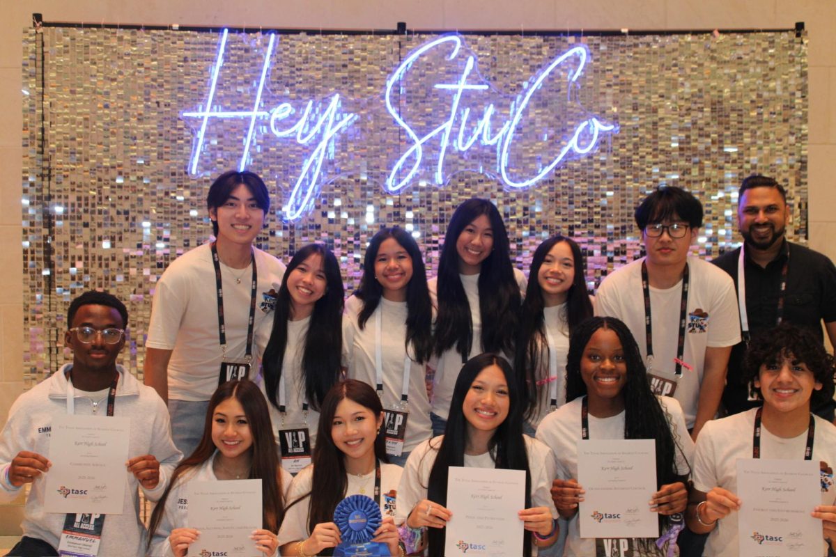 StuCo State: Kerr Student Council Officers Emmanuel Okoroji, Jessica Le, Janet Duong, Lisa Le, Chelsea Eboh, Marcos Coronado, Ebs Ryan Nguyen,  An Nguyen, Katelyn Nguyen, Yahan Dai, Lena Nguyen, Peter Bui, and Sponsor Safraz Ali posing for a picture at the Henry B. Gonzalez Convention Center. StuCo officers holding awards they’ve won for getting sweepstakes for their state report. “It was such a fun trip, we learned so much about leadership and got to spend time with each other.” Nguyen said. 