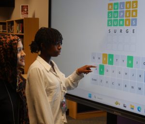 Freshmen Safiyah Khan and Gloria Lushanga work together to decipher the Wordle of the Day.