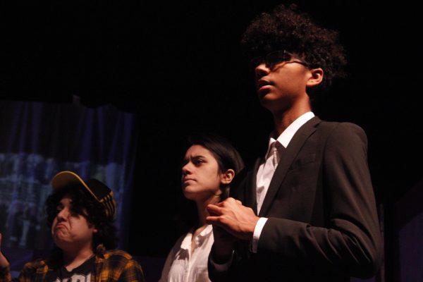 Artificially funny: The scene comes to a close as Xabian Esparza (9), Elysha Stiles (11), and Noah McBride (10) rehearse a scene from 2026 Smile N Nod. They lead characters Zara Larsson, bad bunny, and Michael B Jordan to the resolution of the show. "I think this year's show was especially funny, I'm going to miss a lot of parts of it so I'm really excited to see what's in store for next year's too" Stiles said.